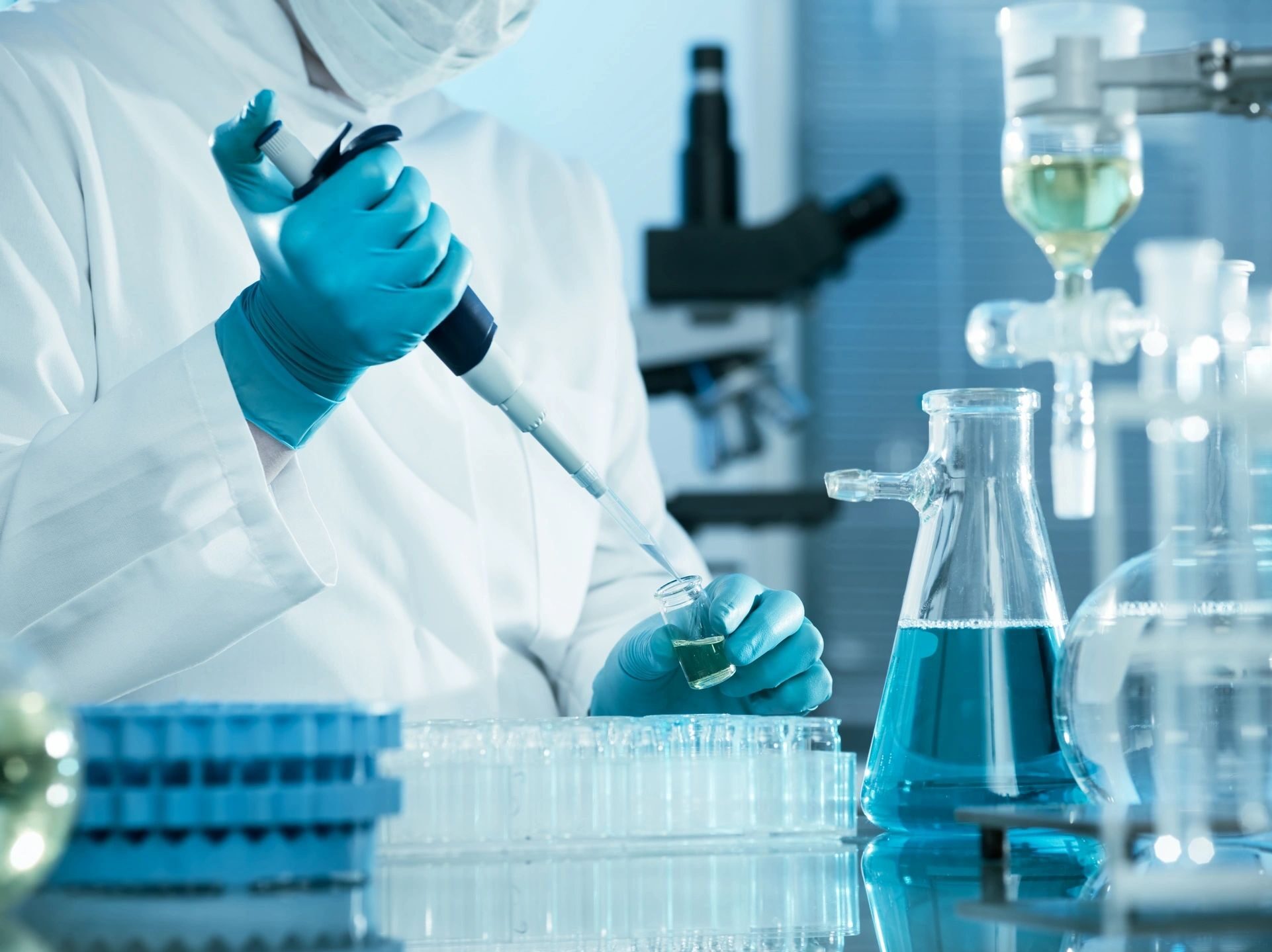 Capabilities: image of scientist using a pipette 